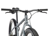 Détail de l'étrier de frein à disque hydraulique Shimano MT410 et du disque 180 mm du Kona Unit X, pour un freinage constant même en descente chargée.