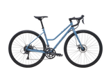 Vélo gravel urbain à cadre ouvert Marin Nicasio 1 ST 2025, coloris Blue, en vue latérale complète. On y voit le cadre en acier chromoly à double épaisseur, le cintre drop évasé et les pneus WTB Exposure 700x36c.