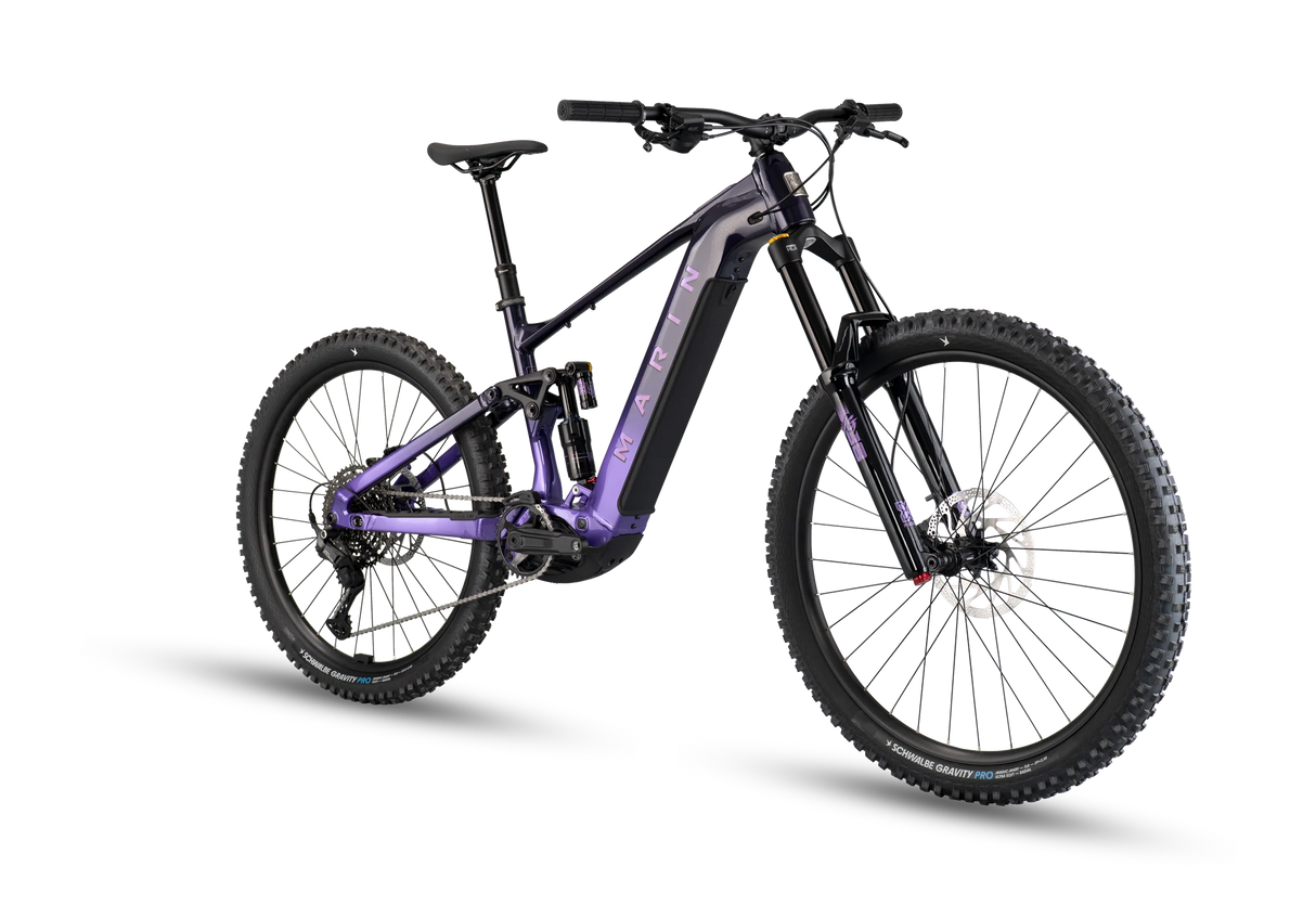 Vue de face du vélo électrique Marin Alpine Trail E1 2026 en Purple Fade montrant la fourche X-Fusion Vengeance 170 mm et le pneu Schwalbe Magic Mary 29 pouces.